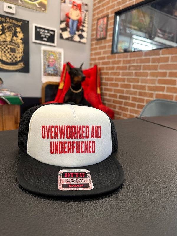 "Overworked and under fucked" snap back hat