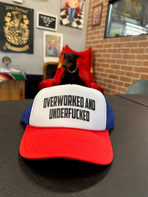 "Overworked and under fucked" snap back hat