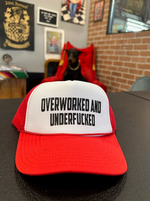 "Overworked and under fucked" snap back hat