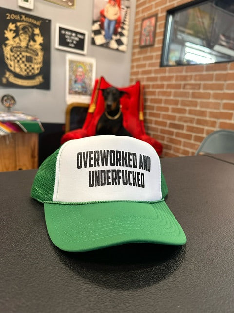 "Overworked and under fucked" snap back hat